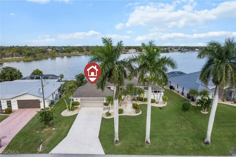 a view of a house with outdoor space and lake view