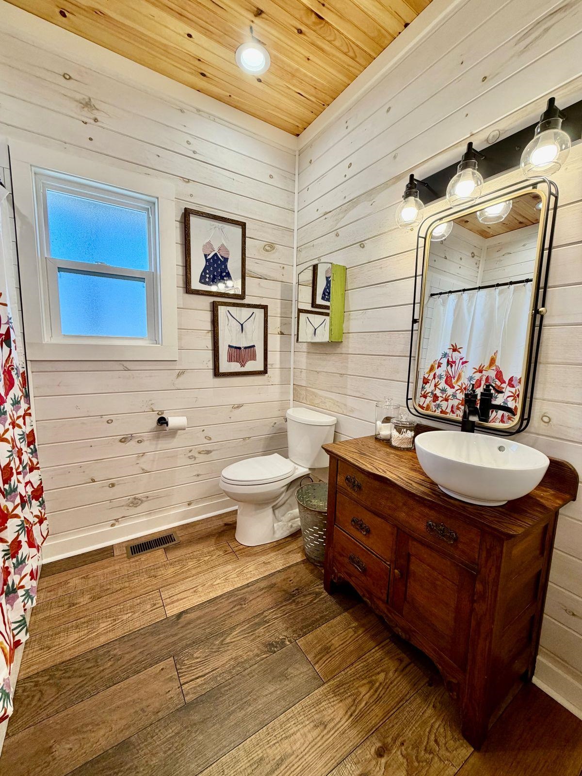 540 Muscatel Lane Counce, TN 38326 - Photo 14 of 32 a bathroom with a toilet a sink and mirror
