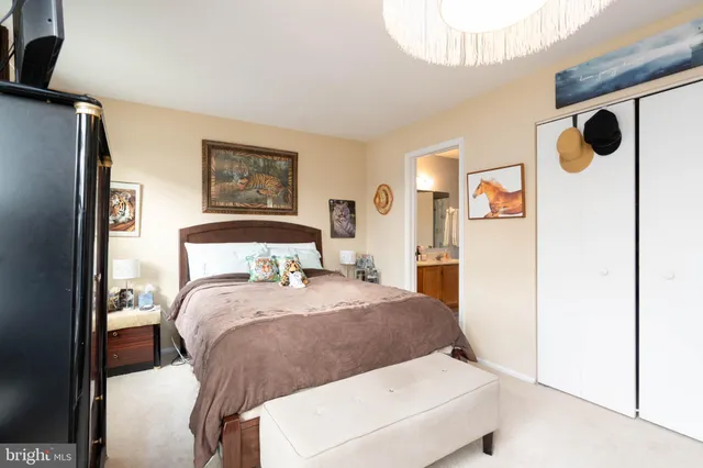 a bed room with a bed and a painting