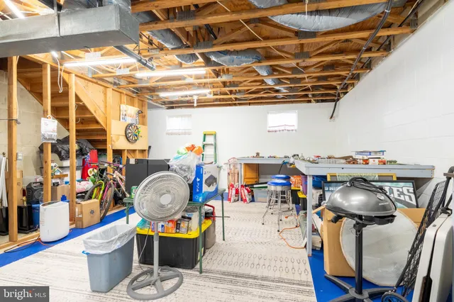 a picture of a room with furniture and wooden floor