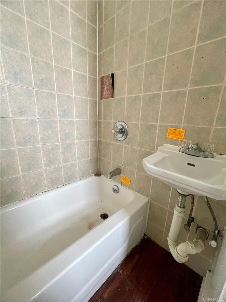 27 Fox Island Road Port Chester, NY 10573 - Photo 12 of 29 a bathroom with a sink and bathtub