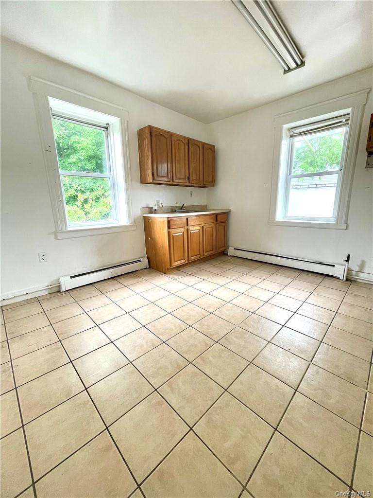 27 Fox Island Road Port Chester, NY 10573 - Photo 18 of 29 a view of a livingroom with wooden floor and a window