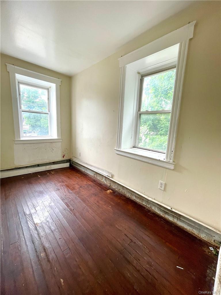 27 Fox Island Road Port Chester, NY 10573 - Photo 21 of 29 an empty room with wooden floor and windows
