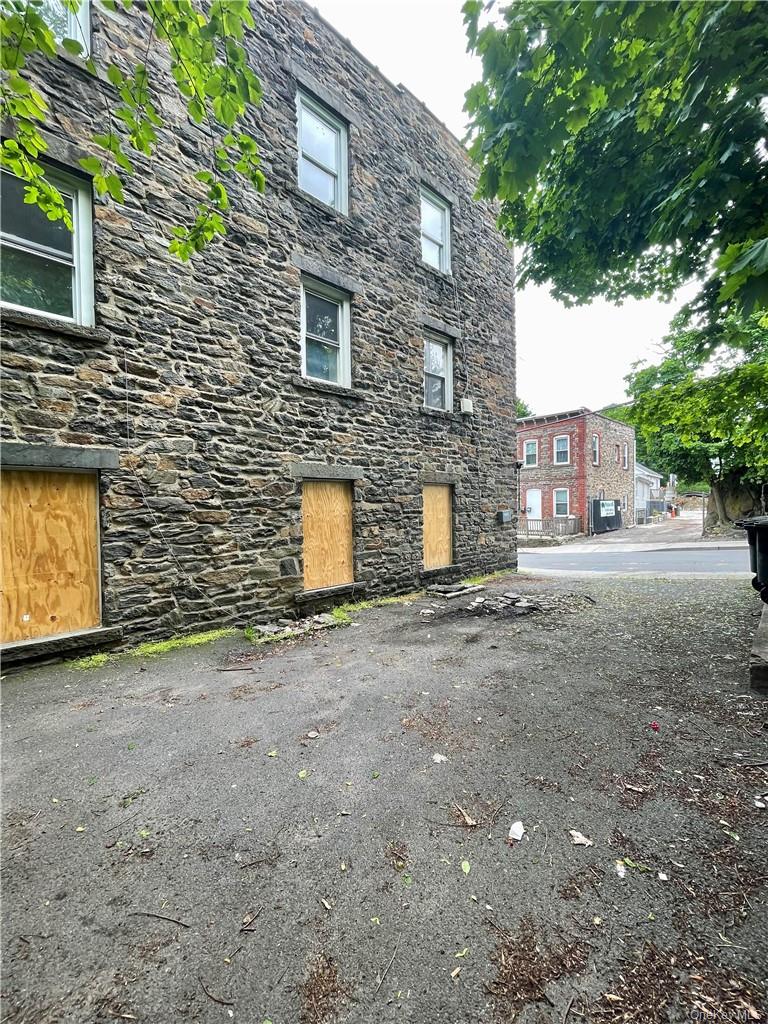 27 Fox Island Road Port Chester, NY 10573 - Photo 27 of 29 a view of a brick wall with a tree in front of it