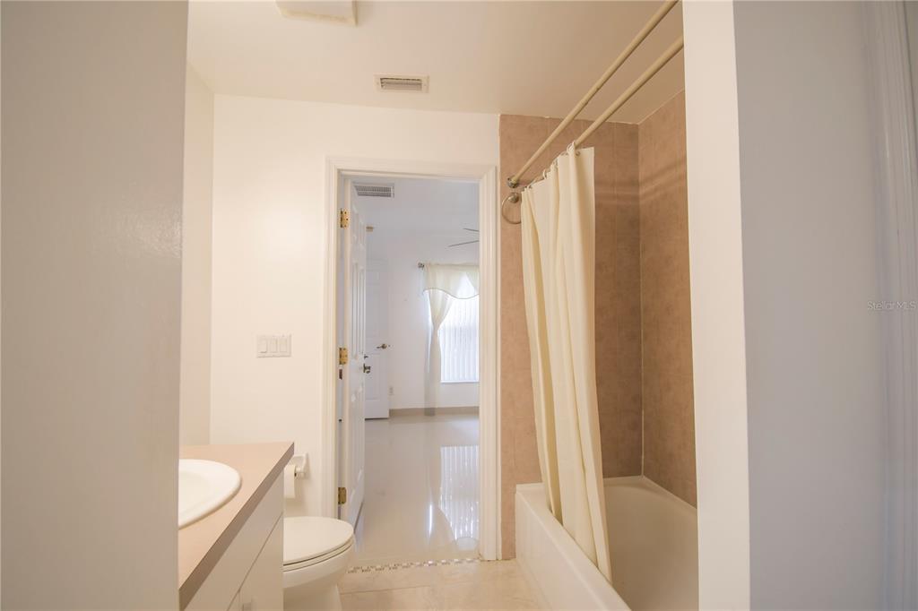 4913 Cromey Road North Port, FL 34288 - Photo 19 of 36 a bathroom with a granite countertop sink and a mirror