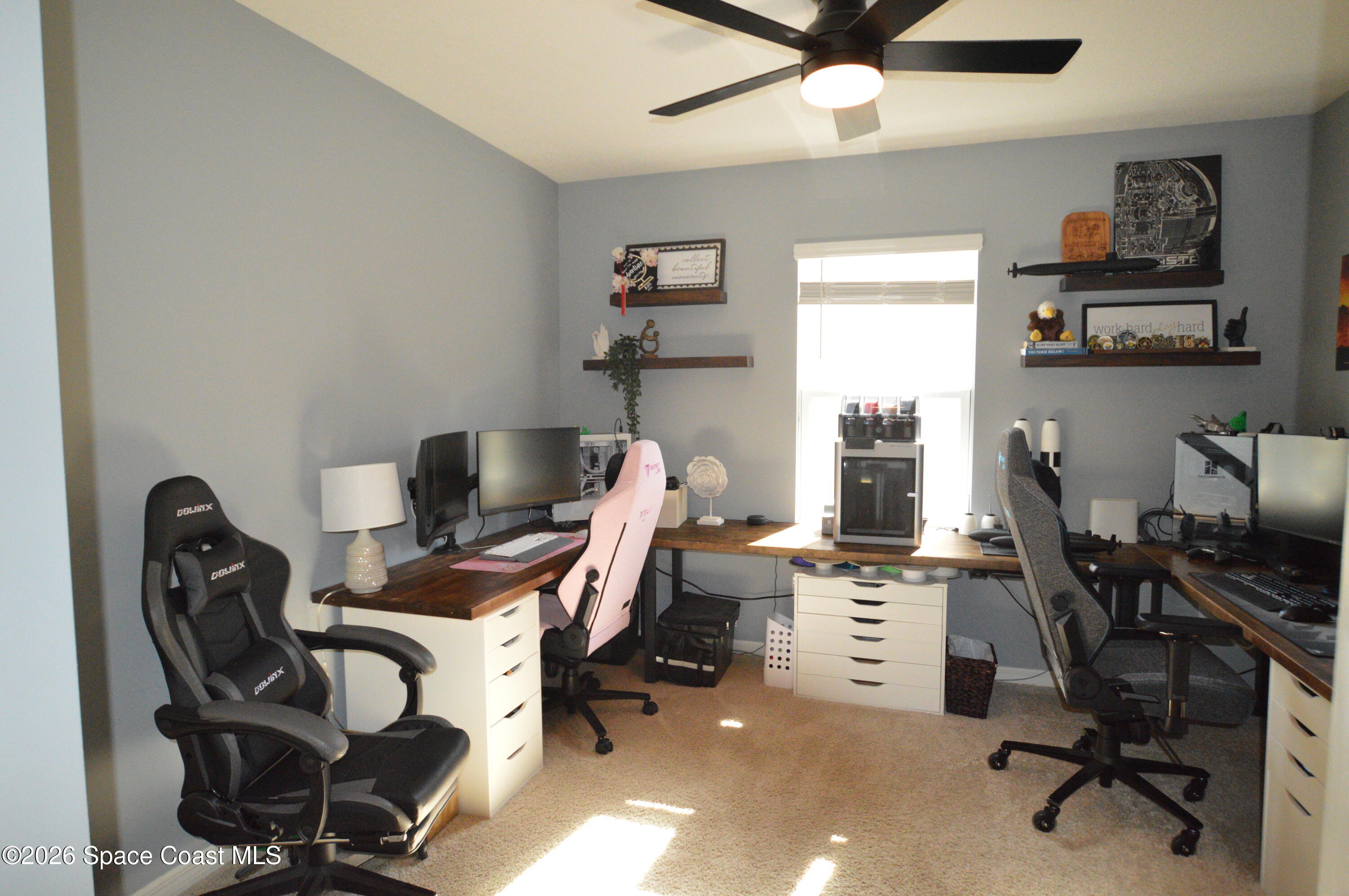 999 Trinity Street Rockledge, FL 32955 - Photo 12 of 20 a view of a workspace with furniture and a window
