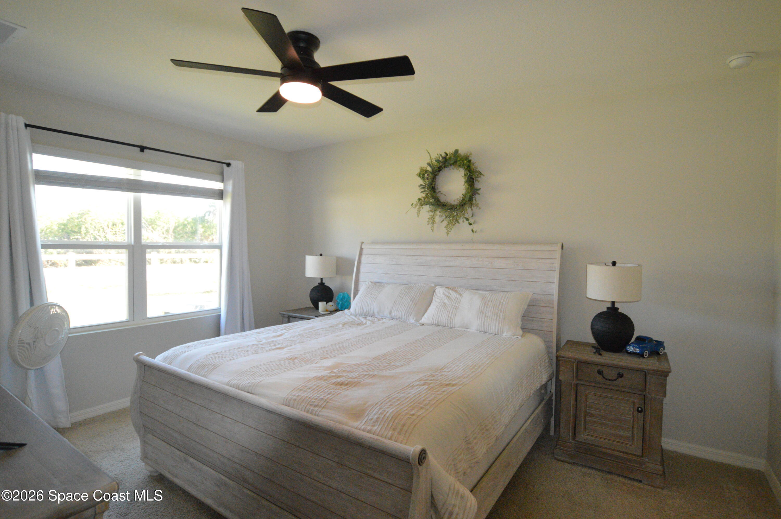 999 Trinity Street Rockledge, FL 32955 - Photo 16 of 20 a bedroom with a bed and a window
