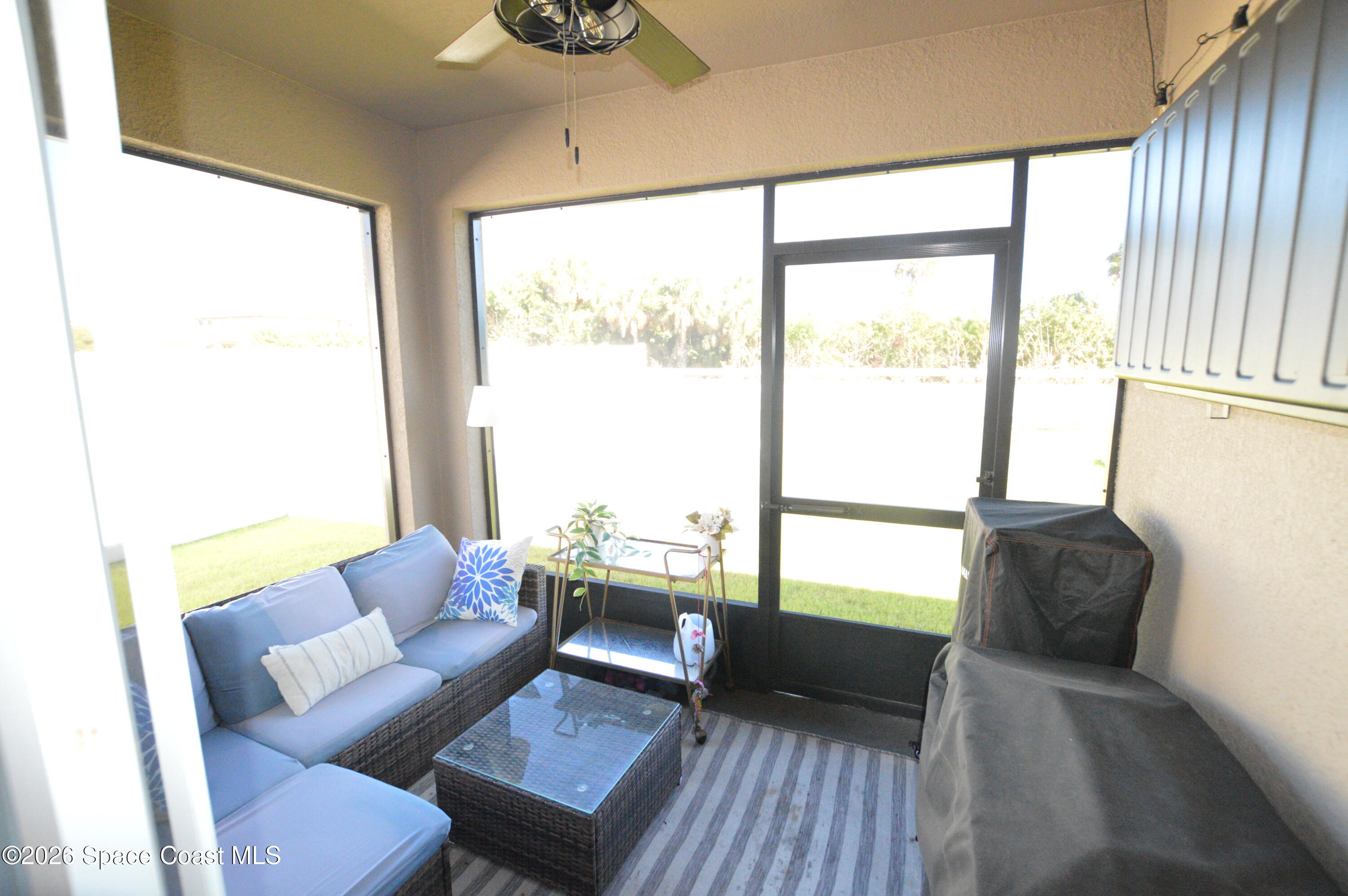 999 Trinity Street Rockledge, FL 32955 - Photo 17 of 20 a living room with furniture and a large window