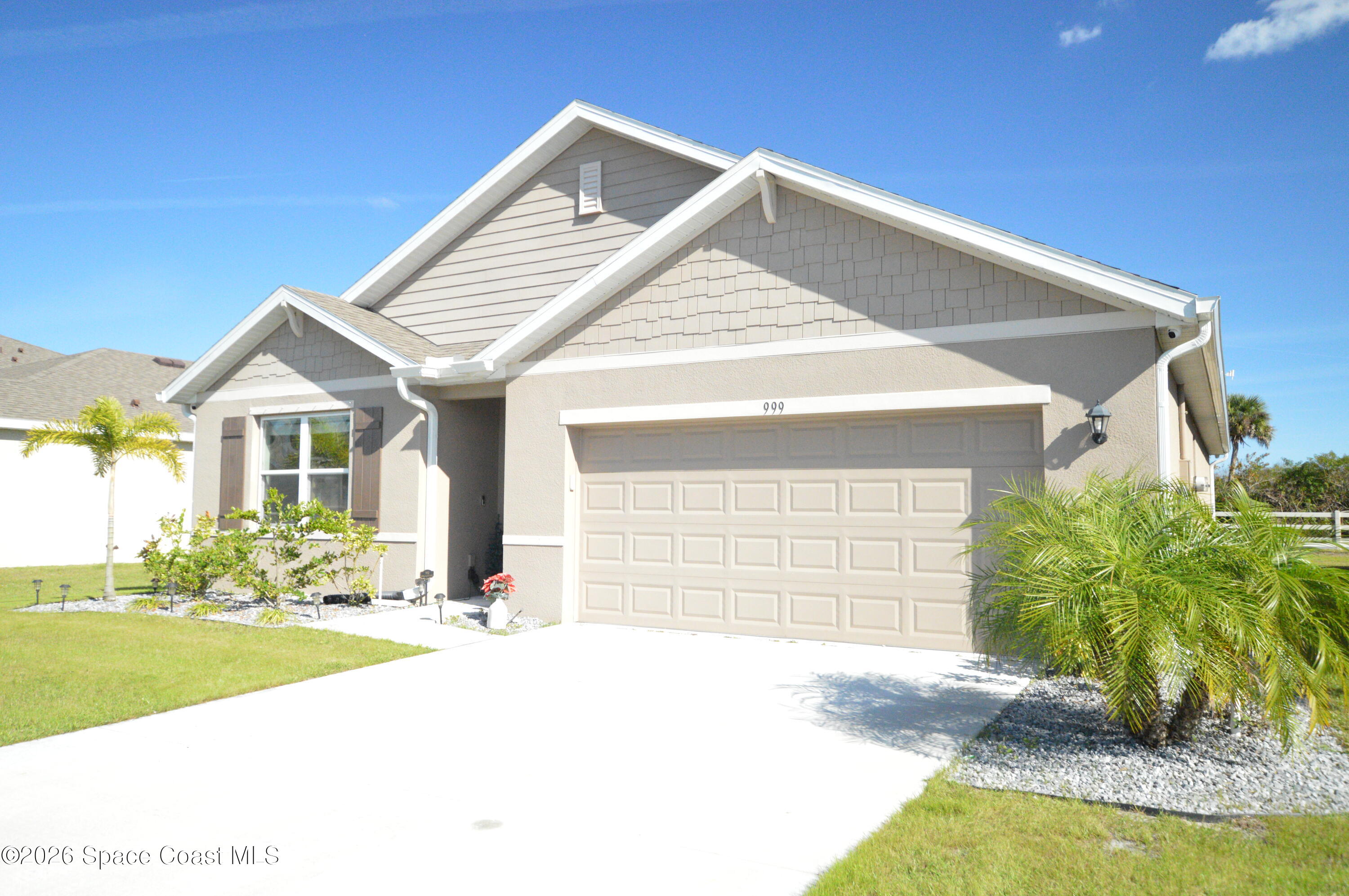 999 Trinity Street Rockledge, FL 32955 - Photo 2 of 20 a front view of a house with a yard
