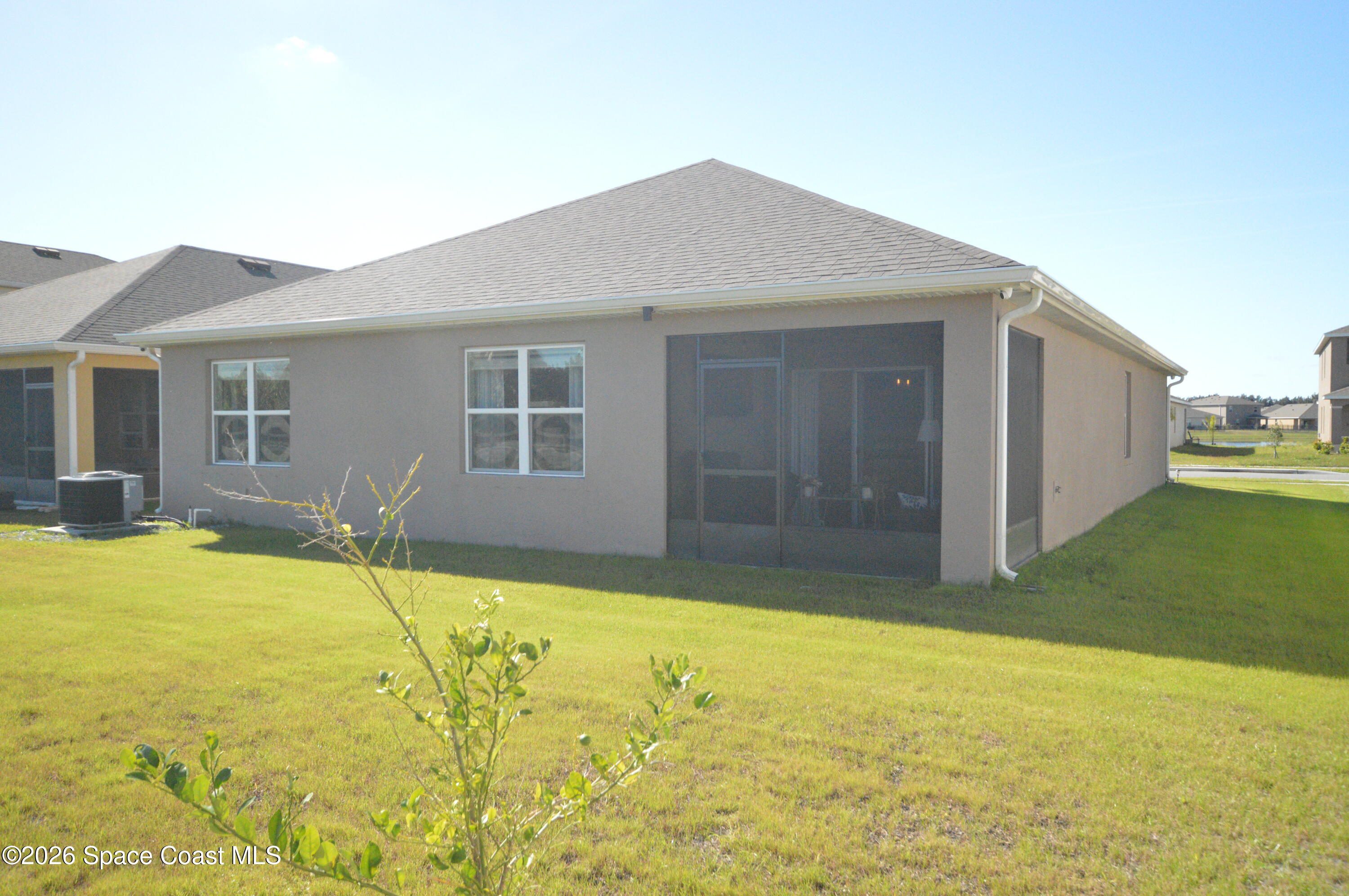 999 Trinity Street Rockledge, FL 32955 - Photo 3 of 20 a house view with swimming pool in front of it