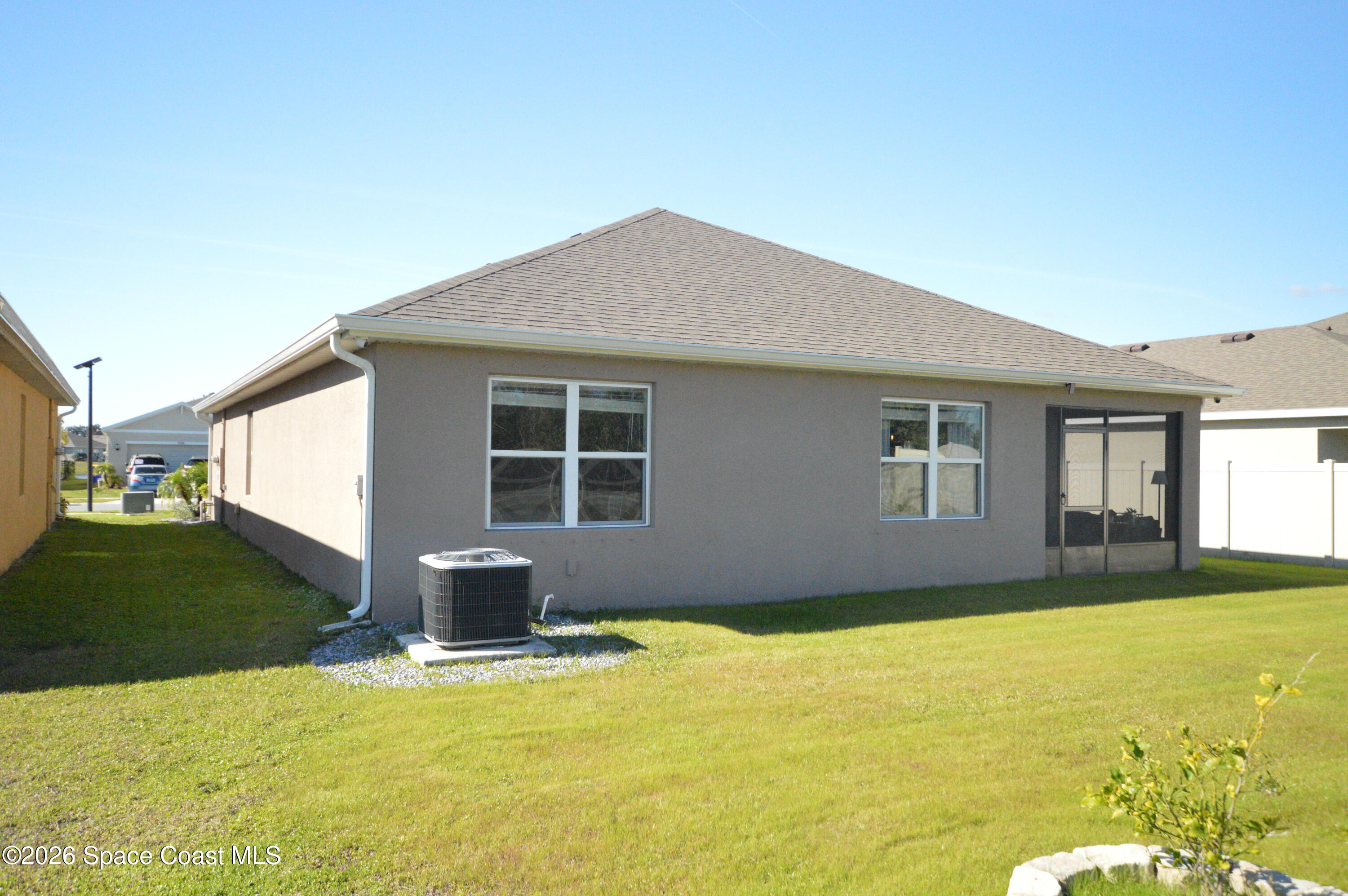 999 Trinity Street Rockledge, FL 32955 - Photo 4 of 20 a front view of a house with a garden