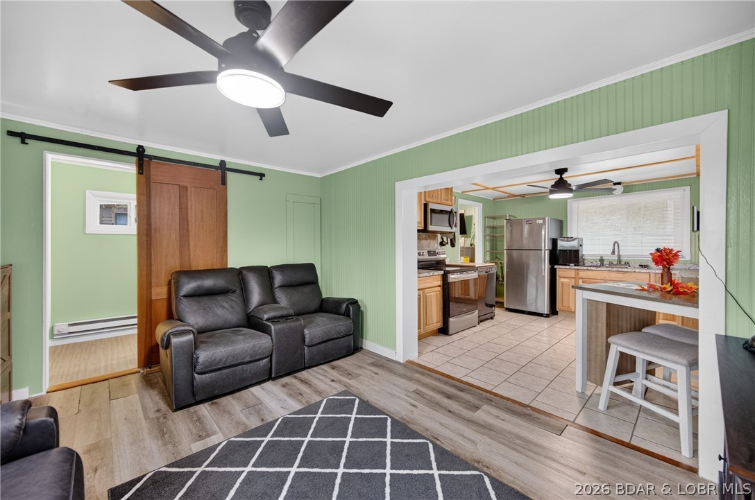 27116 Hard Rock Road Barnett, MO 65011 - Photo 5 of 47 LVP flooring & Stylish door