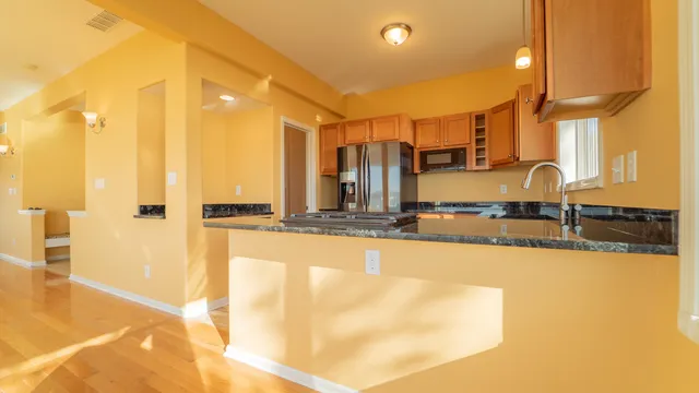 a bathroom with a tub sink and mirror
