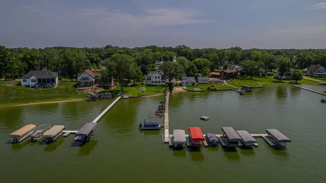 a view of a lake with boats in the background