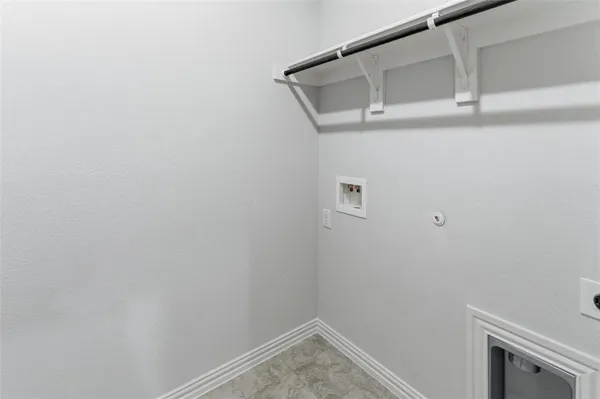 a large kitchen with stainless steel appliances granite countertop a lot of cabinets and wooden floor