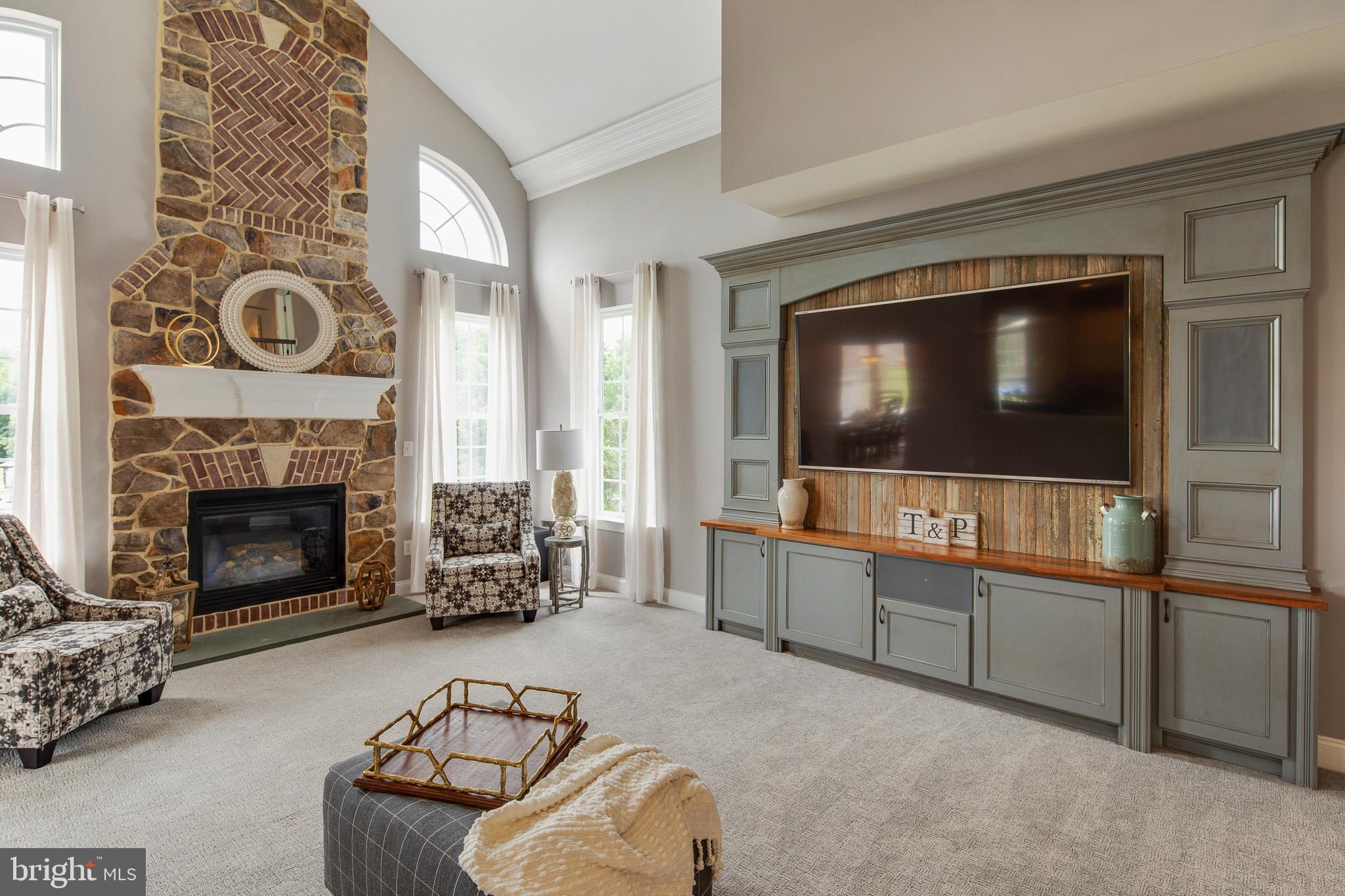 440 Spring Hollow Drive Middletown, DE 19709 - Photo 12 of 64 a living room with furniture and a flat screen tv