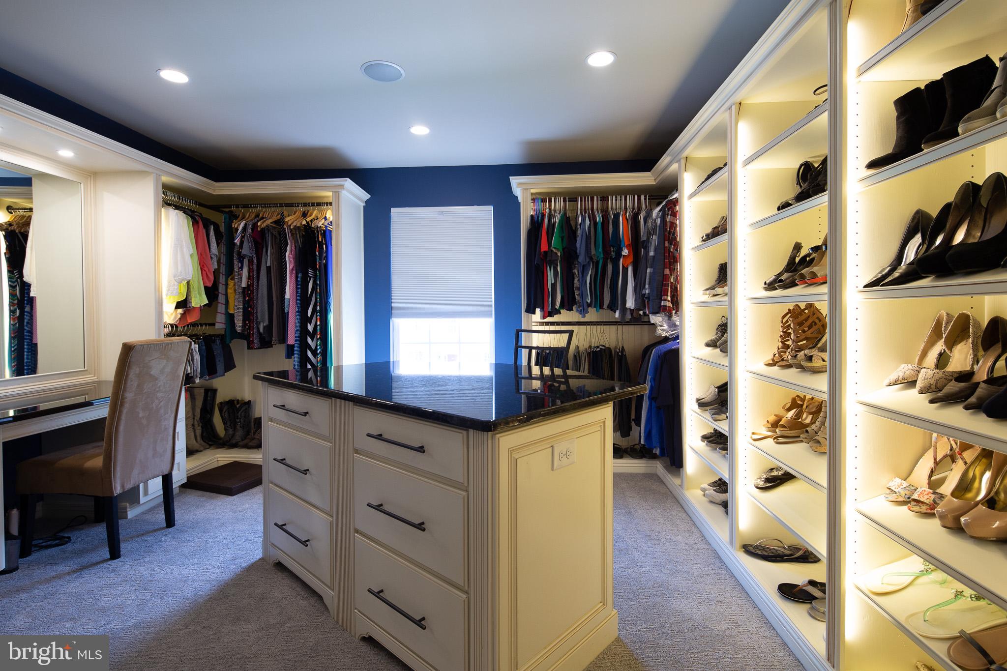 440 Spring Hollow Drive Middletown, DE 19709 - Photo 26 of 64 a kitchen with stainless steel appliances kitchen island granite countertop a refrigerator and a wooden cabinets