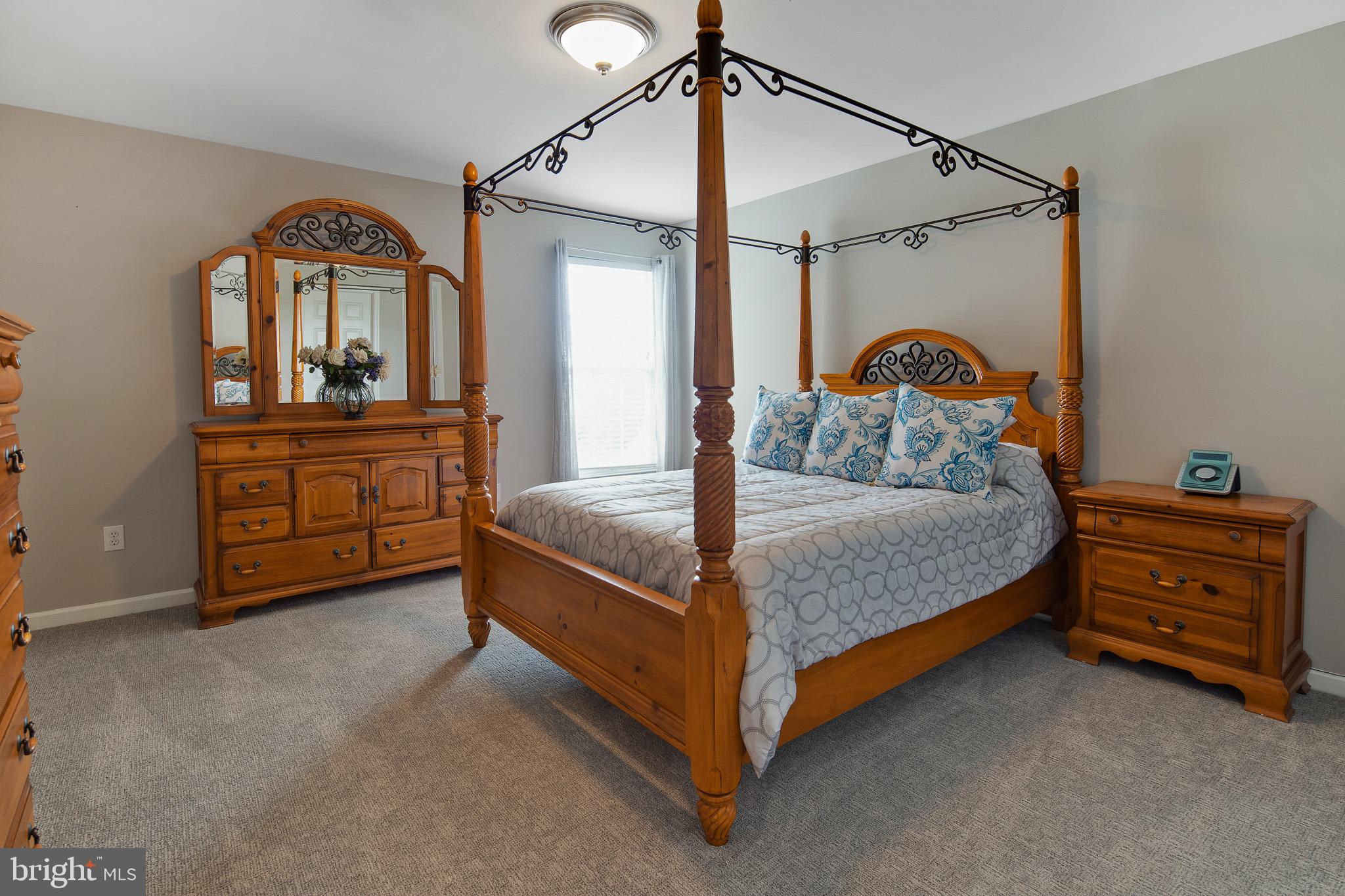 440 Spring Hollow Drive Middletown, DE 19709 - Photo 30 of 64 a bedroom with a bed and a dresser
