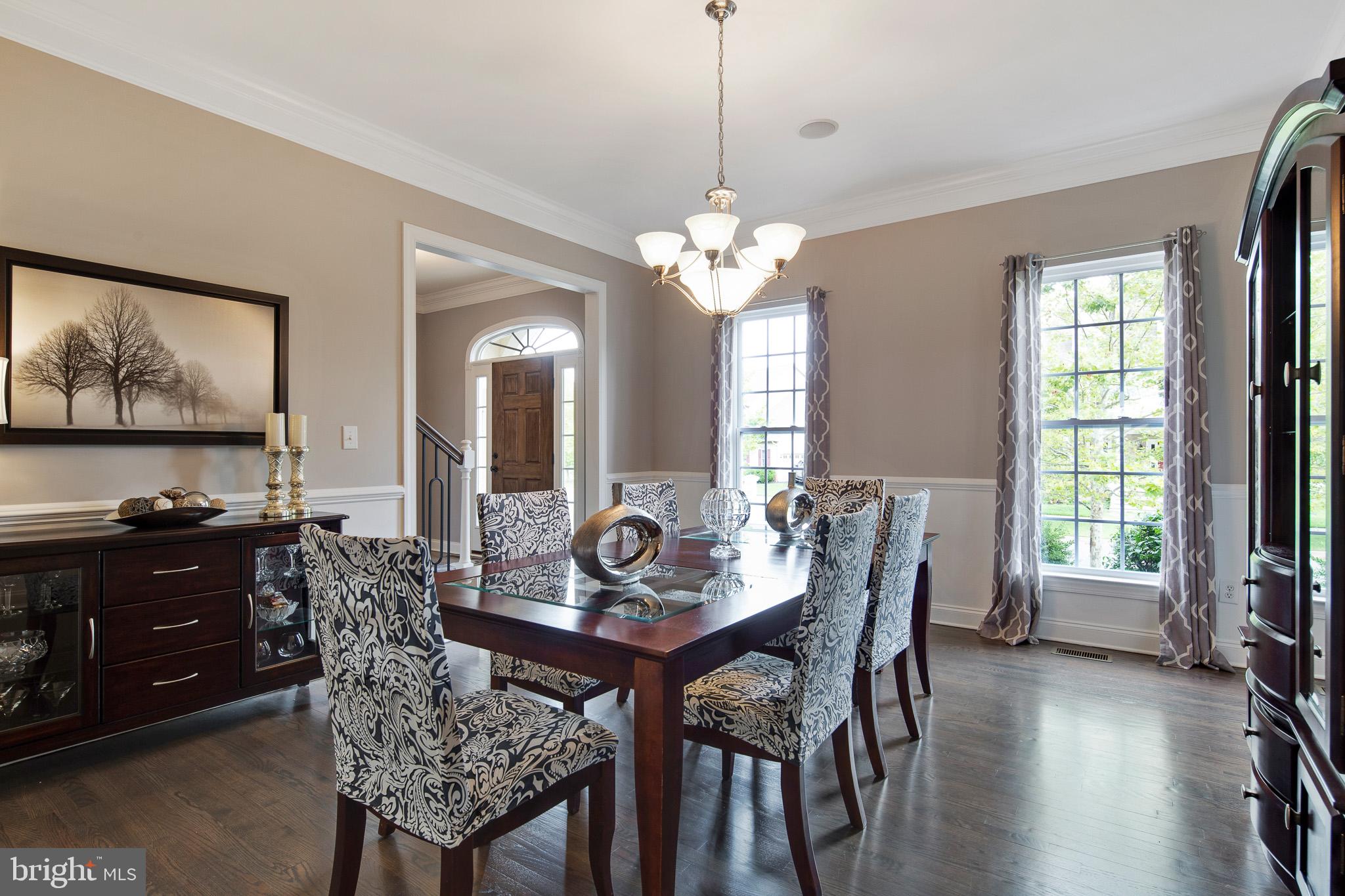 440 Spring Hollow Drive Middletown, DE 19709 - Photo 4 of 64 a view of a dining room with furniture window and wooden floor