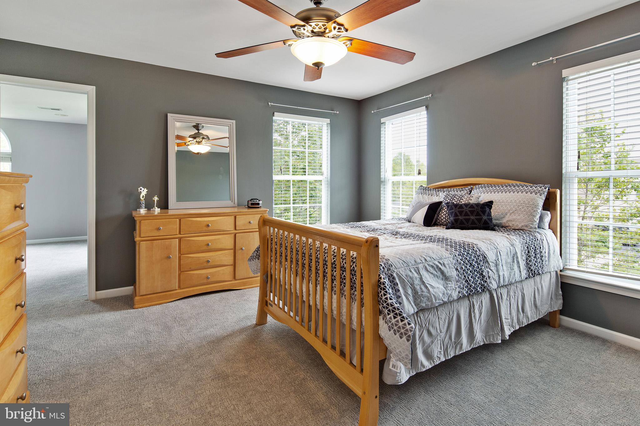 440 Spring Hollow Drive Middletown, DE 19709 - Photo 34 of 64 a bedroom with a bed and a chandelier