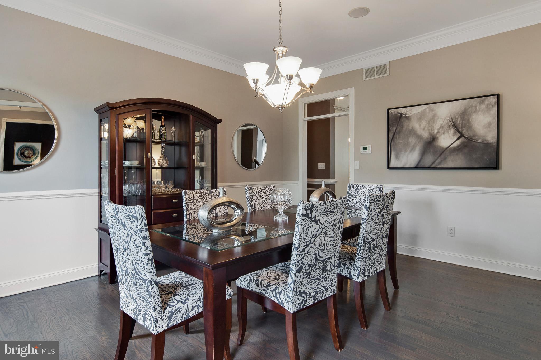440 Spring Hollow Drive Middletown, DE 19709 - Photo 5 of 64 a view of a dining room with furniture and chandelier