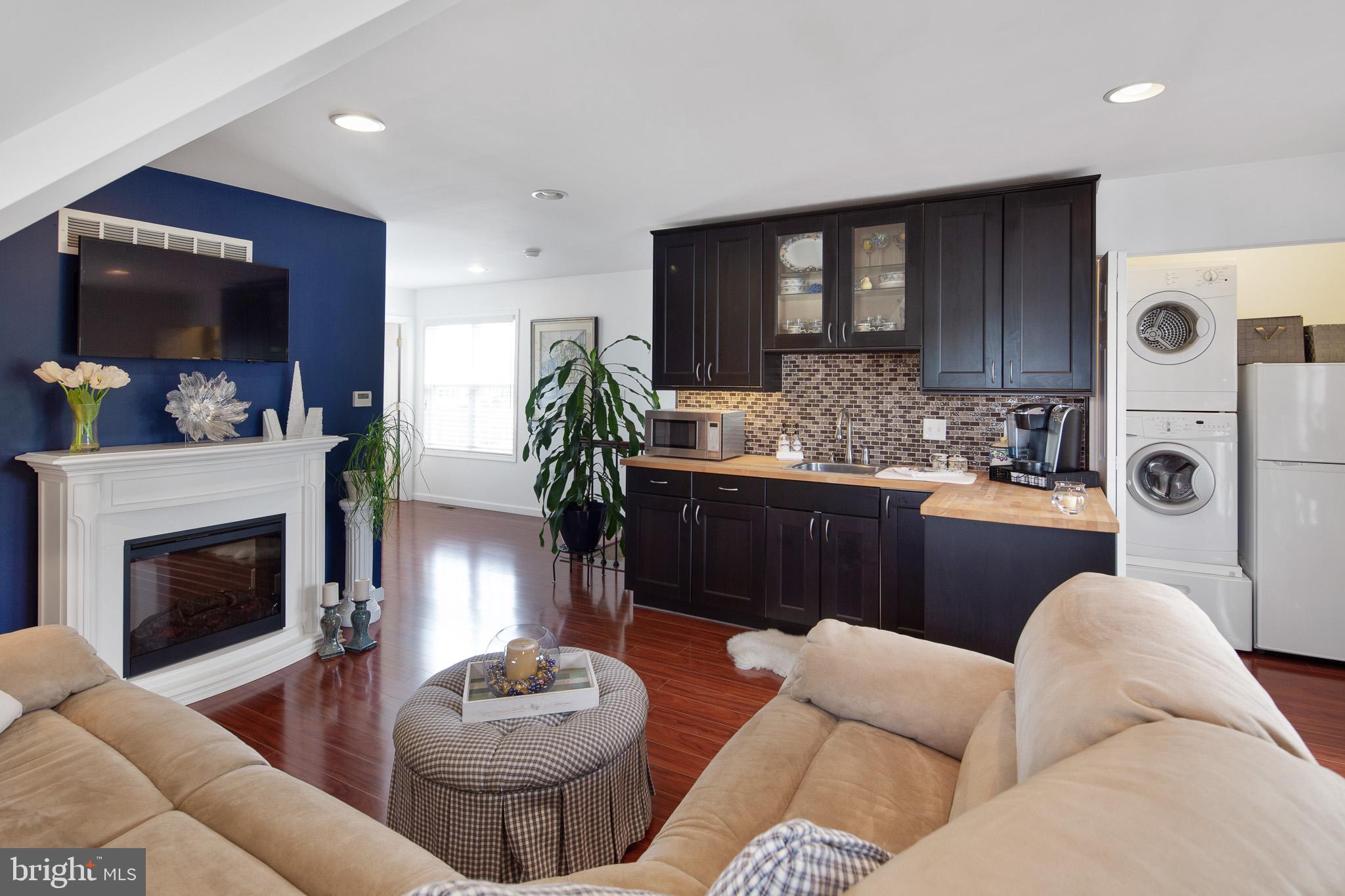 440 Spring Hollow Drive Middletown, DE 19709 - Photo 44 of 64 a living room with furniture and a fireplace