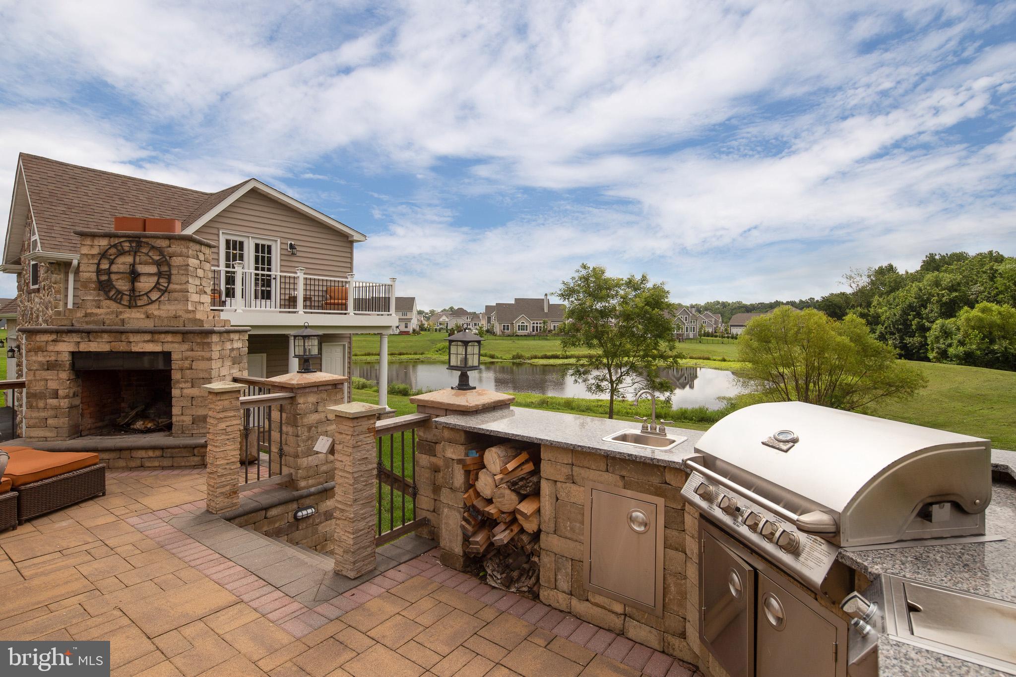 440 Spring Hollow Drive Middletown, DE 19709 - Photo 52 of 64 a view of a house with a sink and a fireplace