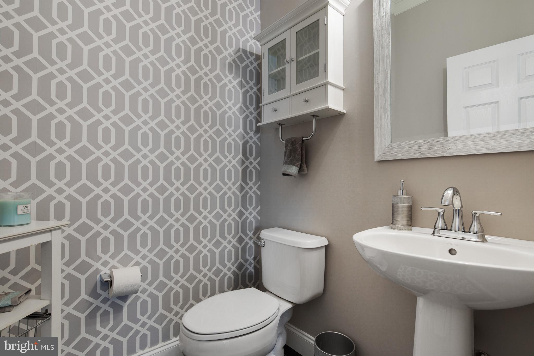 440 Spring Hollow Drive Middletown, DE 19709 - Photo 10 of 64 a bathroom with a sink a toilet and shower curtain