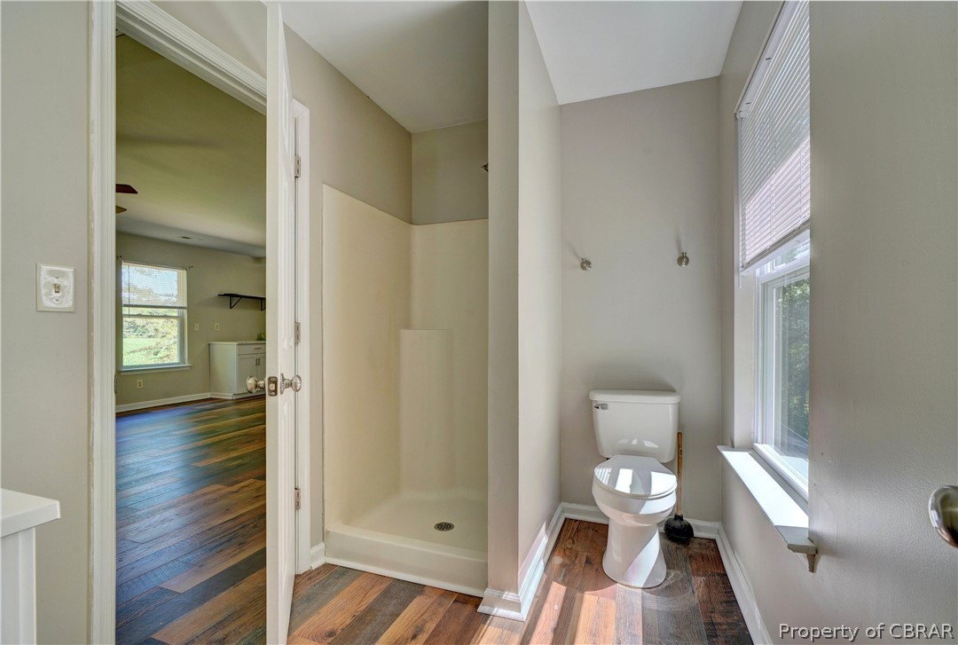 8269 Ark Road Gloucester, VA 23061 - Photo 18 of 33 Bathroom featuring wood-type flooring and toilet