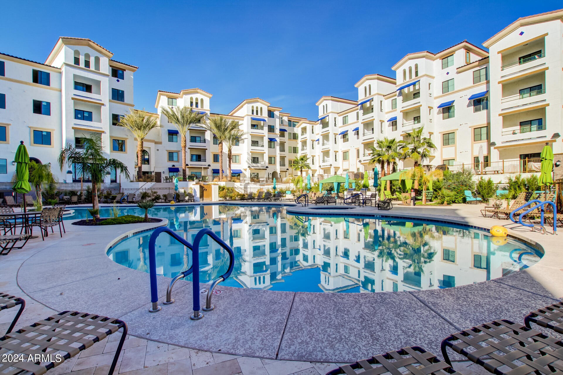 2511 West Queen Creek Road, Unit 374 Chandler, AZ 85248 - Photo 55 of 63 a balcony with table and chairs
