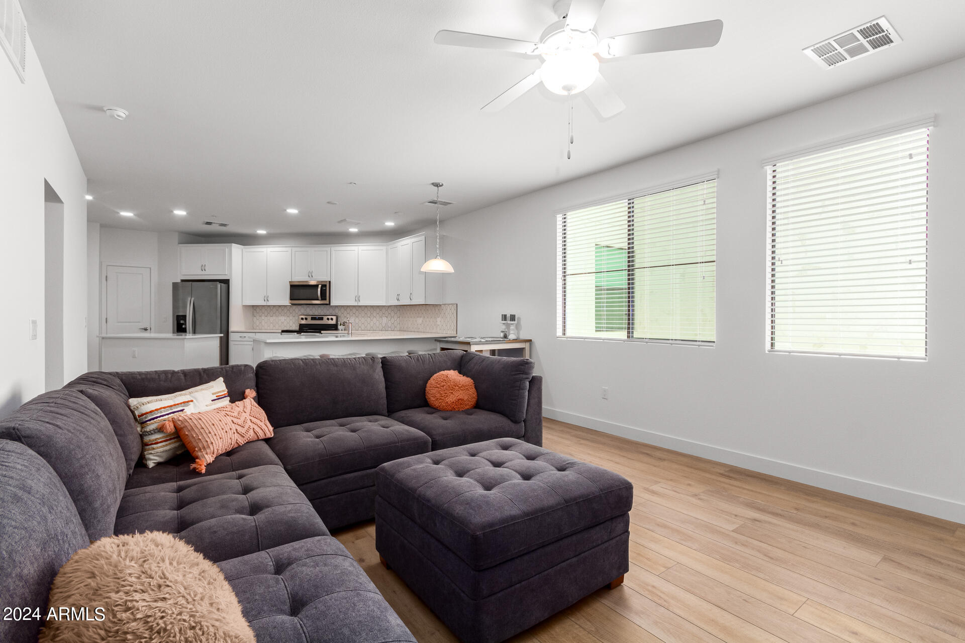 2511 West Queen Creek Road, Unit 374 Chandler, AZ 85248 - Photo 6 of 63 a living room with furniture and a large window