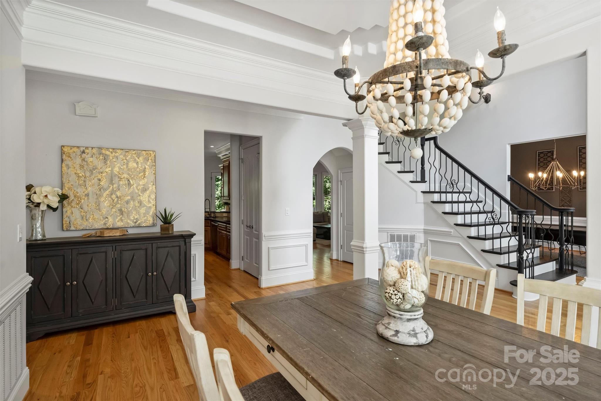 3284 Millstone Creek Road Lancaster, SC 29720 - Photo 12 of 48 a view of a dining room with furniture a chandelier and wooden floor
