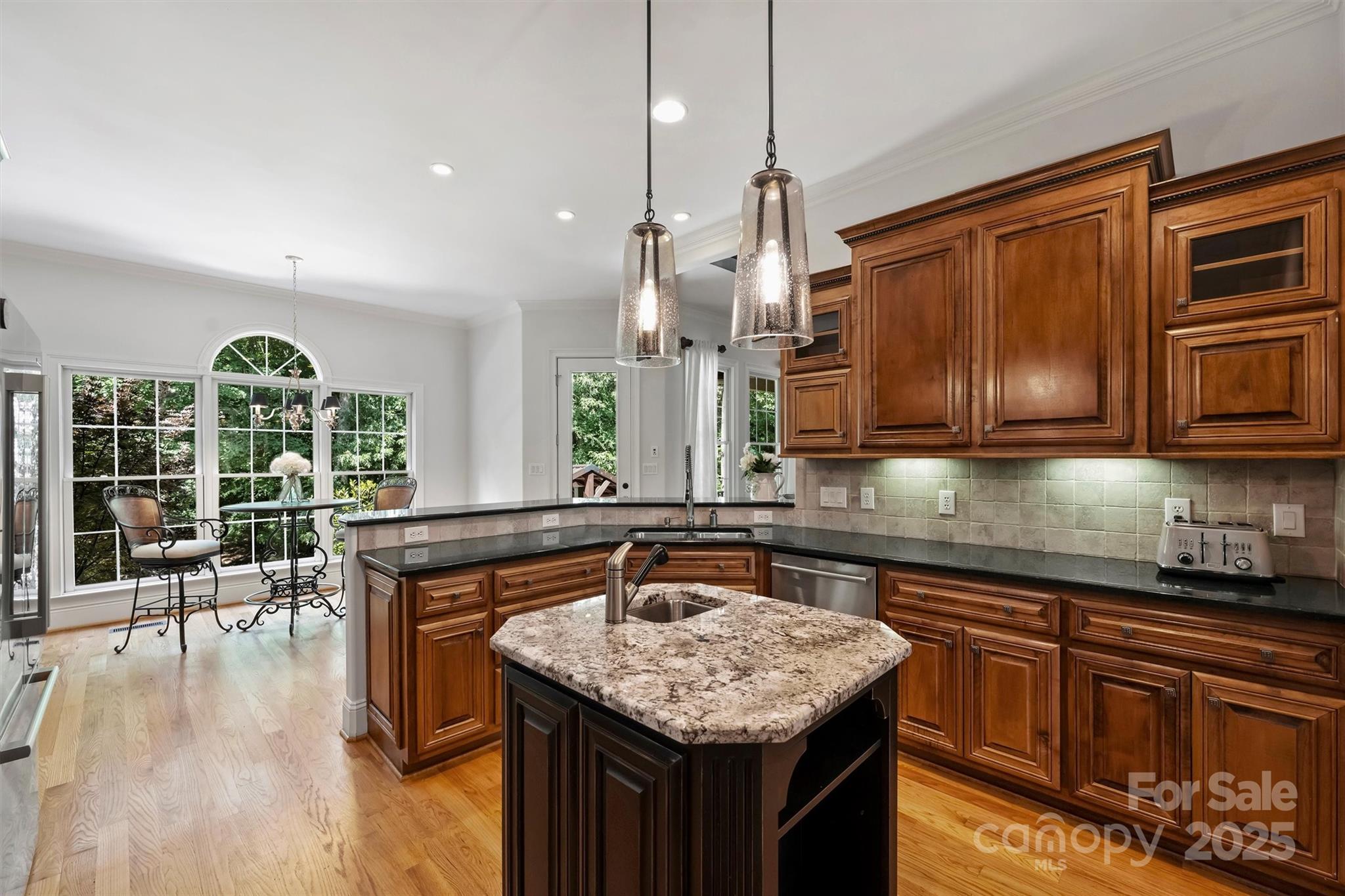 3284 Millstone Creek Road Lancaster, SC 29720 - Photo 17 of 48 a kitchen with granite countertop lots of counter top space and wooden floor
