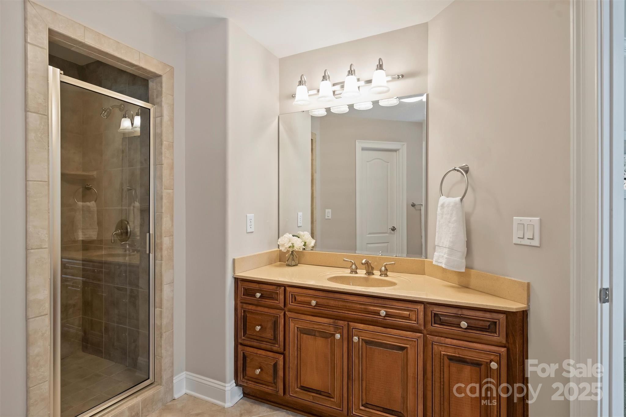 3284 Millstone Creek Road Lancaster, SC 29720 - Photo 35 of 48 a bathroom with a sink vanity and a mirror