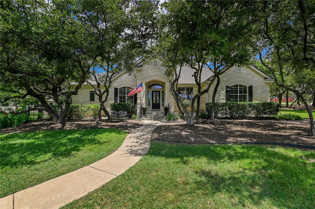 a front view of house with yard and green space