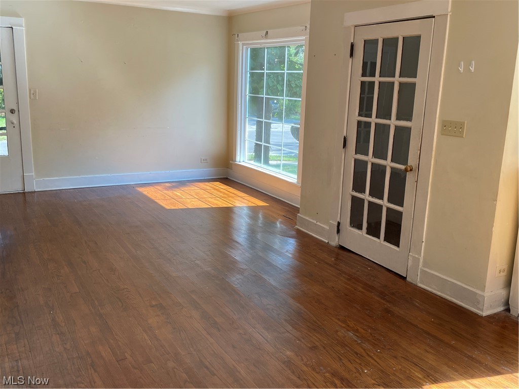 1730 Wood Road Cleveland Heights, OH 44121 - Photo 8 of 34 Spare room featuring ornamental molding and wood-type flooring