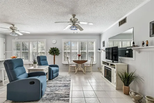 a kitchen with sink refrigerator and microwave