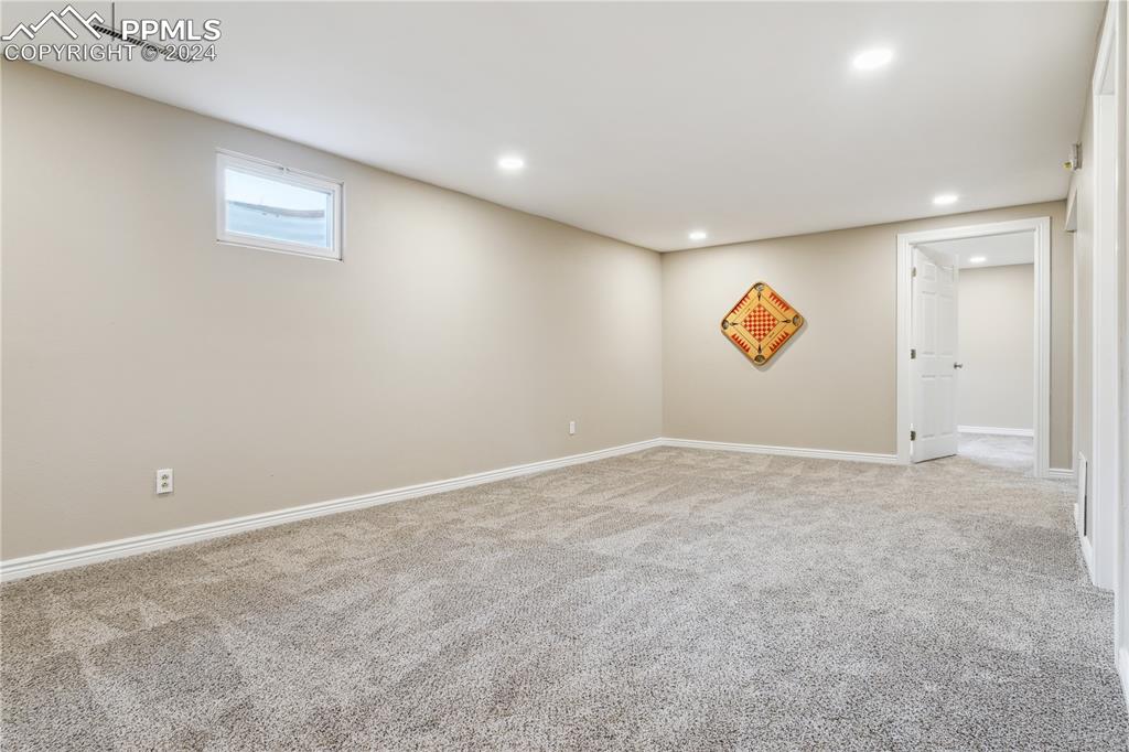 114 Chelton Road Colorado Springs, CO 80910 - Photo 12 of 18 Basement family room with LED lighting and new carpet