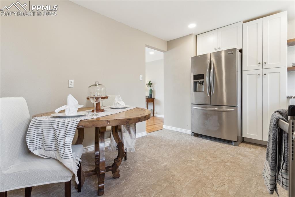 114 Chelton Road Colorado Springs, CO 80910 - Photo 8 of 18 Kitchen and dining area with new cabinets