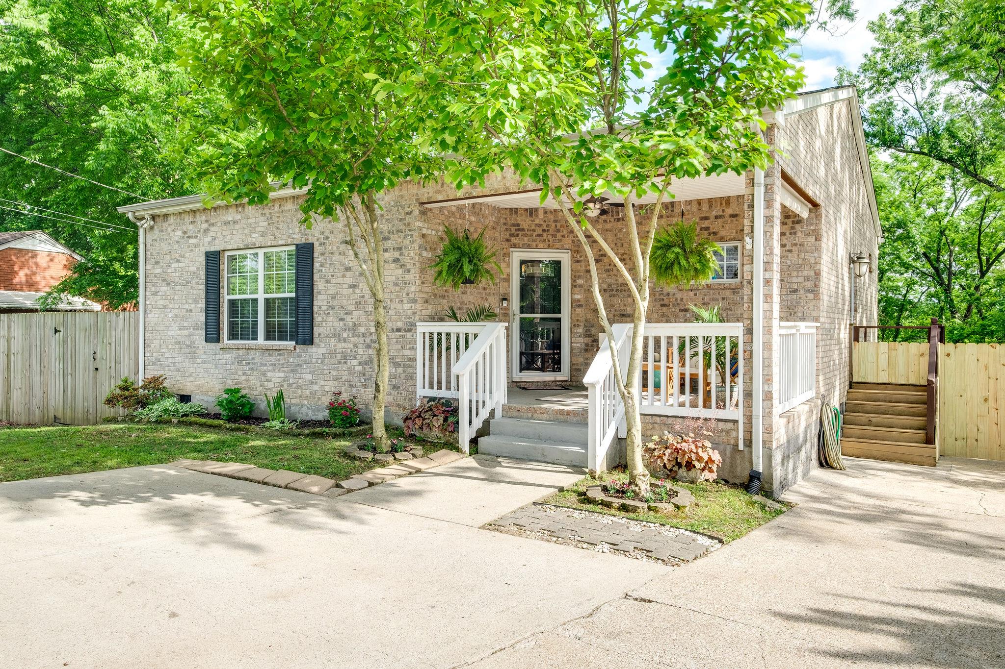 107 Stirton Road Nashville, TN 37210 - Photo 1 of 25 Covered front porch on this all brick cottage in Woodbine area