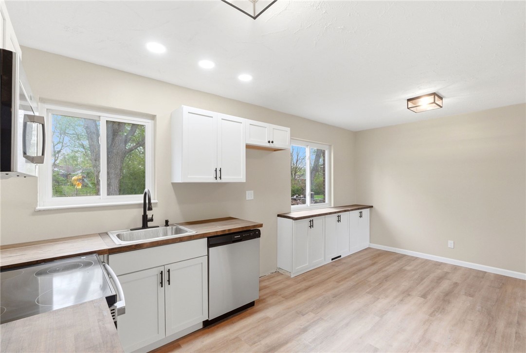 40 Woods Road Springboro, OH 45066 - Photo 28 of 57 This bright kitchen features new appliances and ample cabinet space, ready for your personal touch.