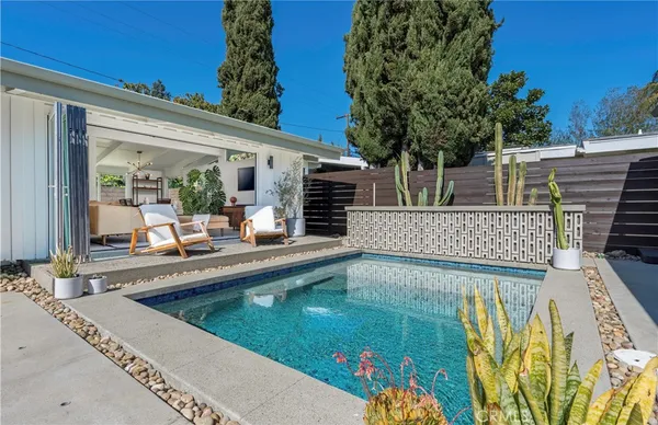 a view of a swimming pool with a patio