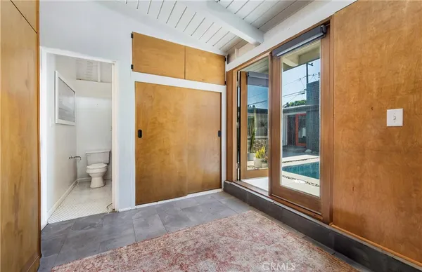 a view of a bathroom with a glass door and shower