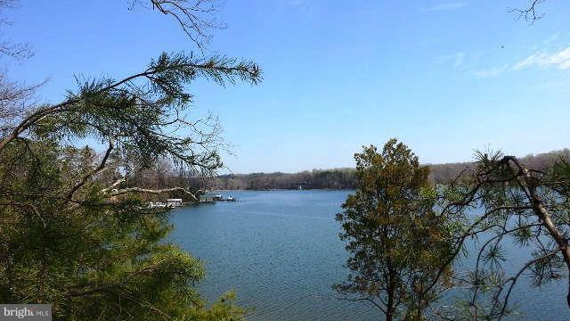 10400 Mackall Road St. Leonard, MD 20685 - Photo 14 of 14 a view of a houses with a lake
