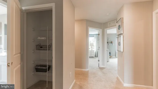 a view of a bedroom with furniture and windows