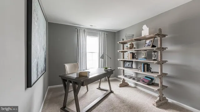 a spacious bedroom with a large bed and a large window