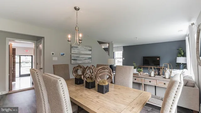 a dining room with furniture and wooden floor