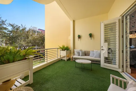 a view of a balcony with chairs