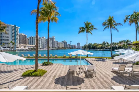 a view of swimming pool with a table and chairs