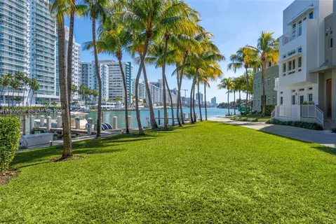 a swimming pool with outdoor seating and yard
